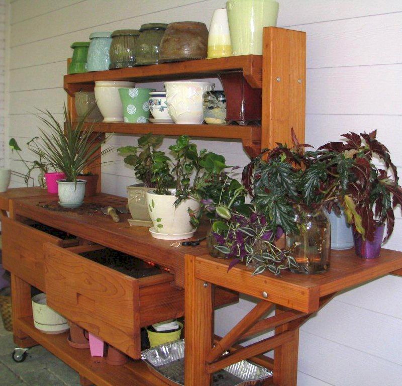Eli's Redwood Potting Bench (Options: XL Size, Mature Redwood, Casters, 2 Shelves, Both Sides Fold Down, Copper Inset for Both Drawers, No Engraving, Removable Slatted Lid Over Left Drawer, Transparent Premium Sealant). Photo Courtesy of Leslie Hanna of Reston, Virginia. Eli's Redwood Potting Bench (Options: XL Size, Mature Redwood, Casters, 2 Shelves, Both Sides Fold Down, Copper Inset for Both Drawers, No Engraving, Removable Slatted Lid Over Left Drawer, Transparent Premium Sealant). Photo Courtesy of Leslie Hanna of Reston, Virginia.