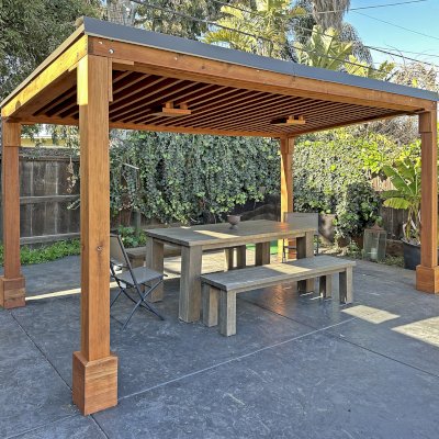 Emma's Modern Pavilion (Options: 8' x 15', No Privacy Panel, California Redwood, 8' H, 1 Electrical Wiring Trim, No Post Decorative Trim, 2 Ceiling Fan Bases [Ceiling Fan Bases Are Angled to Compensate for the Roof Pitch], No Curtain Rods, Transparent Premium Sealant). Photo Courtesy of C. Noa of San Mateo, CA.