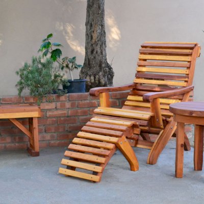 Ensenada Ottoman (Options: California Redwood, Transparent Premium Sealant). Photo also shows an Ensenada Easychair, Round Side Table & Lighthouse Bench. 