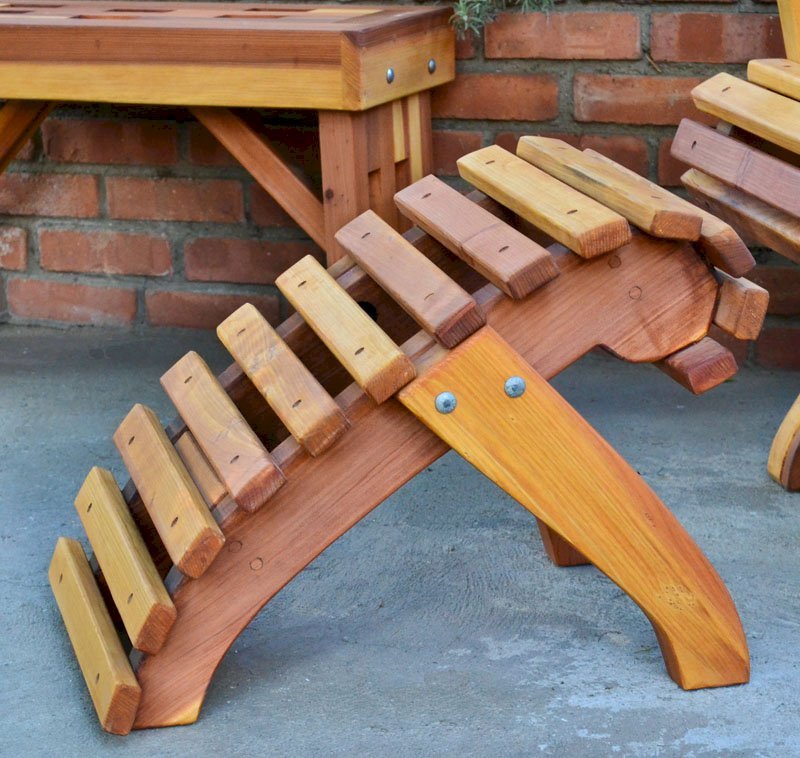 Ensenada Ottoman (Options: California Redwood, Transparent Premium Sealant). Lighthouse Bench & Ensenada Easychair in the background. Ensenada Ottoman (Options: California Redwood, Transparent Premium Sealant). Lighthouse Bench & Ensenada Easychair in the background.