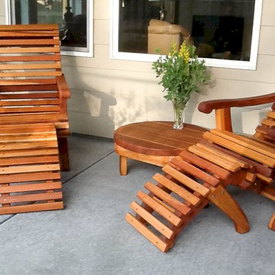 Ensenada Wood Easy Chair (Options: Standard Size, California Redwood, No Cushion, Ottoman, Transparent Premium Sealant). Photo also shows a Round Side Table.