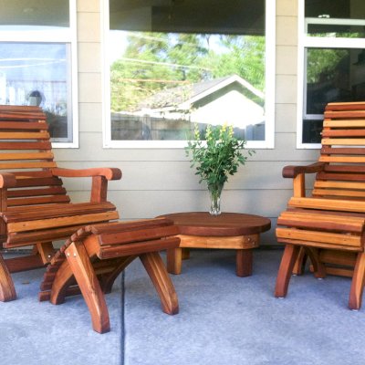 Ensenada Wood Easy Chair (Options: Standard Size, California Redwood, No Cushion, Ottoman, Transparent Premium Sealant). Photo also shows a Round Side Table.Ottomans placed in reverse by customer. They like it this way and we don't argue with our customers!