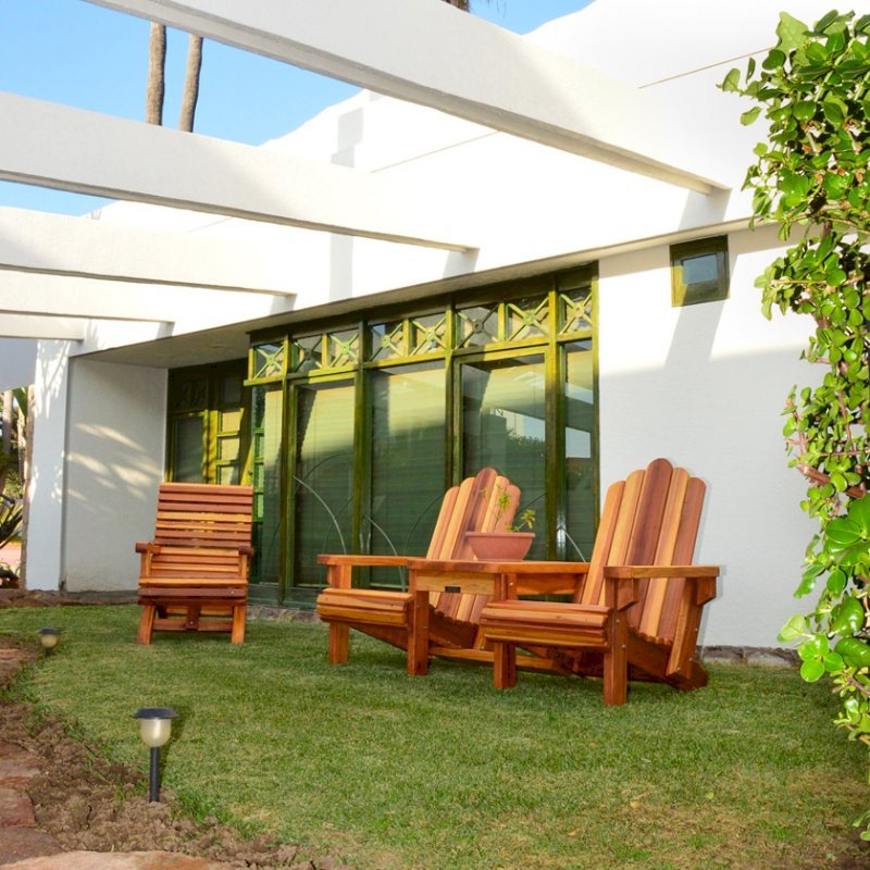 Ensenada Wood Easy Chair (Options: Standard Size, Mature Redwood, No Cushion, No Ottoman, Transparent Premium Sealant) with an Adirondack Vignette Settee. Photo Courtesy of El Estero Beach Resort of Ensenada, Baja. Ensenada Wood Easy Chair (Options: Standard Size, Mature Redwood, No Cushion, No Ottoman, Transparent Premium Sealant) with an Adirondack Vignette Settee. Photo Courtesy of El Estero Beach Resort of Ensenada, Baja.