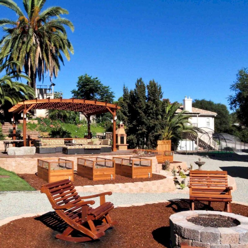 Ensenada Highback Rocking Chair (Options: Extra Wide, California Redwood, No Cushion, Transparent Premium Sealant) and 16' x 20' Arched Pergola. Photo courtesy of Mr. M. Tomacelli of Fallbrook, CA. Ensenada Highback Rocking Chair (Options: Extra Wide, California Redwood, No Cushion, Transparent Premium Sealant) and 16' x 20' Arched Pergola. Photo courtesy of Mr. M. Tomacelli of Fallbrook, CA.