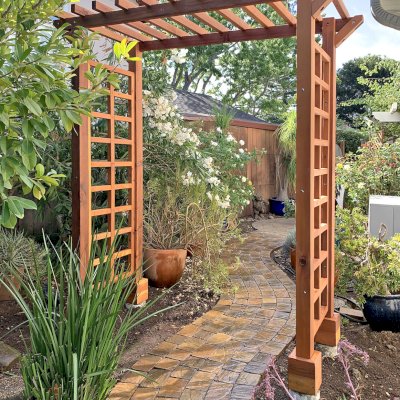 Entryway Arbor (Options: 96" W, 36" D, California Redwood, 4-Post Archor Kit for Concrete, Transparent Premium Sealant). Photo Courtesy of C. Baeuerlen of Los Altos, CA.