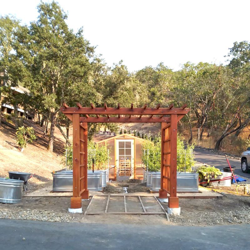 Custom Entryway Arbor (Options: 120" W, 84" D, California Redwood, 4-Post Archor Kit for Concrete, Transparent Premium Sealant) with 6 x 6 Posts and 2 x 6 Rafters by Custom Request. Photo Courtesy of K. Moore of Healdsburg, CA. Custom Entryway Arbor (Options: 120" W, 84" D, California Redwood, 4-Post Archor Kit for Concrete, Transparent Premium Sealant) with 6 x 6 Posts and 2 x 6 Rafters by Custom Request. Photo Courtesy of K. Moore of Healdsburg, CA.