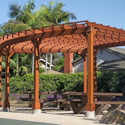 Fan Shaped Pergola Kit (Options: 35' x 16', Mature Redwood, With Roof Slats, No Electrical Wiring Trim Kit, 8-Post Anchor Kit for Concrete, No Ceiling Fan Base, 9.5' Posts, No Curtain Rods, Transparent Premium Sealant). Photo Courtesy of M. Roberts of Carpinteria, California.