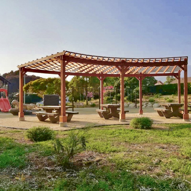 Fan Shaped Pergola Kit (Options: 22' x 25', California Redwood, With Roof Slats, No Electrical Wiring Trim Kit, 8-Post Anchoring for Concrete, No Ceiling Fan Base, 9.5' Posts, No Curtain Rods, Transparent Premium Sealant). Photo Courtesy of Vedic Education and Devotional Academy of Milpitas, California. Fan Shaped Pergola Kit (Options: 22' x 25', California Redwood, With Roof Slats, No Electrical Wiring Trim Kit, 8-Post Anchoring for Concrete, No Ceiling Fan Base, 9.5' Posts, No Curtain Rods, Transparent Premium Sealant). Photo Courtesy of Vedic Education and Devotional Academy of Milpitas, California.