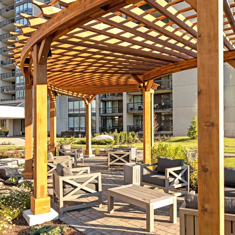 Fan Shaped Pergola Kit (Options: 38' x 14', California Redwood, With Roof Slats, 1 Electrical Wiring Trim Kit, 8-Post Anchor Kit for High-Wind, No Ceiling Fan Base, 10' Posts, No Curtain Rods, Transparent Premium Sealant). Photo Courtesy of A. Finnegan of Toronto, Ontario, Canada. Fan Shaped Pergola Kit (Options: 38' x 14', California Redwood, With Roof Slats, 1 Electrical Wiring Trim Kit, 8-Post Anchor Kit for High-Wind, No Ceiling Fan Base, 10' Posts, No Curtain Rods, Transparent Premium Sealant). Photo Courtesy of A. Finnegan of Toronto, Ontario, Canada.