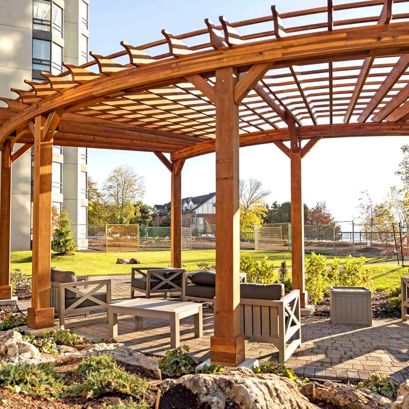 Fan Shaped Pergola Kit (Options: 38' x 14', California Redwood, With Roof Slats, 1 Electrical Wiring Trim Kit, 8-Post Anchor Kit for High-Wind, No Ceiling Fan Base, 10' Posts, No Curtain Rods, Transparent Premium Sealant). Photo Courtesy of A. Finnegan of Toronto, Ontario, Canada. Fan Shaped Pergola Kit (Options: 38' x 14', California Redwood, With Roof Slats, 1 Electrical Wiring Trim Kit, 8-Post Anchor Kit for High-Wind, No Ceiling Fan Base, 10' Posts, No Curtain Rods, Transparent Premium Sealant). Photo Courtesy of A. Finnegan of Toronto, Ontario, Canada.