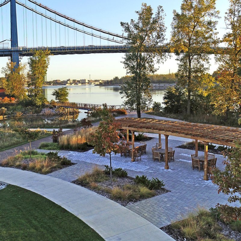 Fan Shaped Pergola Kit (Options: 50' x 14', California Redwood, Roof Slats at 18", No Electrical Wiring Trim Kit, 9-Post Anchor Kit for Concrete, No Ceiling Fan Base, 9.5' Posts, No Curtain Rods, Transparent Premium Sealant). Photo Courtesy of Metroparks Toledo of Toledo, OH. Fan Shaped Pergola Kit (Options: 50' x 14', California Redwood, Roof Slats at 18", No Electrical Wiring Trim Kit, 9-Post Anchor Kit for Concrete, No Ceiling Fan Base, 9.5' Posts, No Curtain Rods, Transparent Premium Sealant). Photo Courtesy of Metroparks Toledo of Toledo, OH.