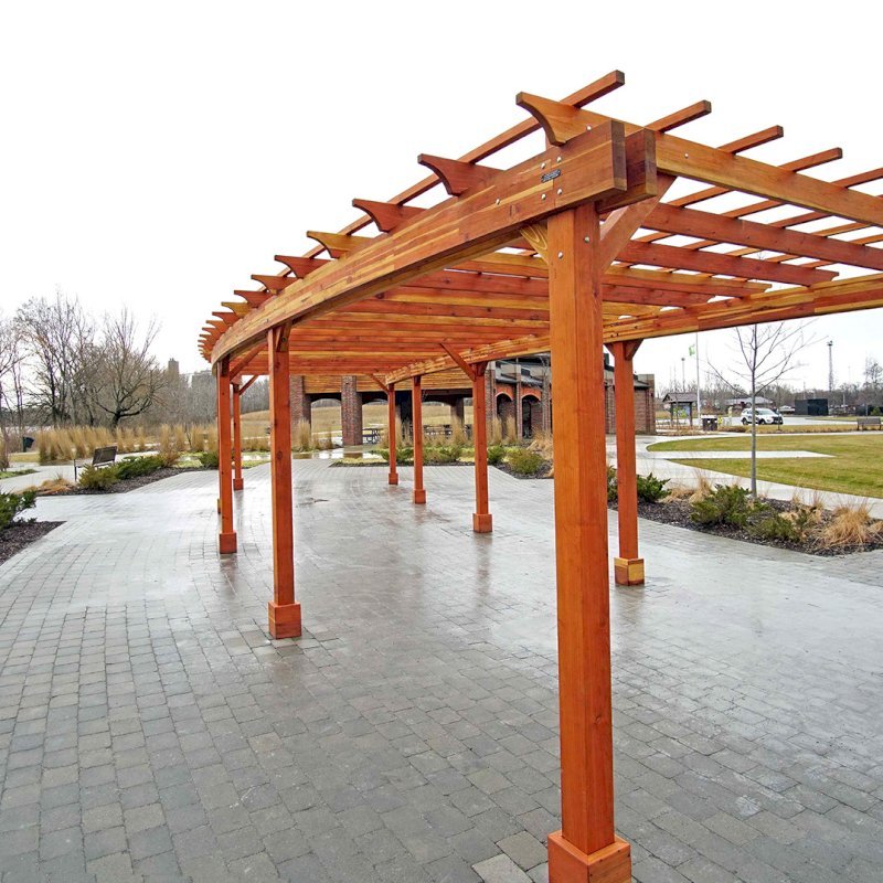 Fan Shaped Pergola Kit (Options: 50' x 14', California Redwood, Roof Slats at 18", No Electrical Wiring Trim Kit, 9-Post Anchor Kit for Concrete, No Ceiling Fan Base, 9.5' Posts, No Curtain Rods, Transparent Premium Sealant). Photo Courtesy of Metroparks Toledo of Toledo, OH. Fan Shaped Pergola Kit (Options: 50' x 14', California Redwood, Roof Slats at 18", No Electrical Wiring Trim Kit, 9-Post Anchor Kit for Concrete, No Ceiling Fan Base, 9.5' Posts, No Curtain Rods, Transparent Premium Sealant). Photo Courtesy of Metroparks Toledo of Toledo, OH.