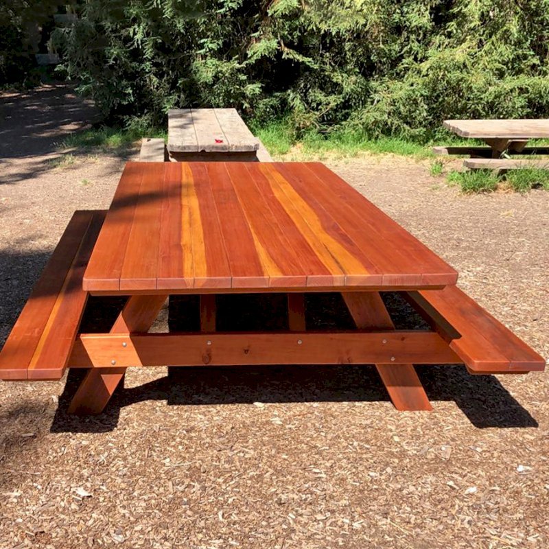 Forever Picnic Table (Attached Benches) (Options: 10' L x 60" W, California Redwood, Standard Tabletop, No Umbrella Hole, Slightly Rounded Corners, With One Bench Trimmed, Transparent Premium Sealant). Photo Courtesy of G. Toy of fairfax, California. Forever Picnic Table (Attached Benches) (Options: 10' L x 60" W, California Redwood, Standard Tabletop, No Umbrella Hole, Slightly Rounded Corners, With One Bench Trimmed, Transparent Premium Sealant). Photo Courtesy of G. Toy of fairfax, California.