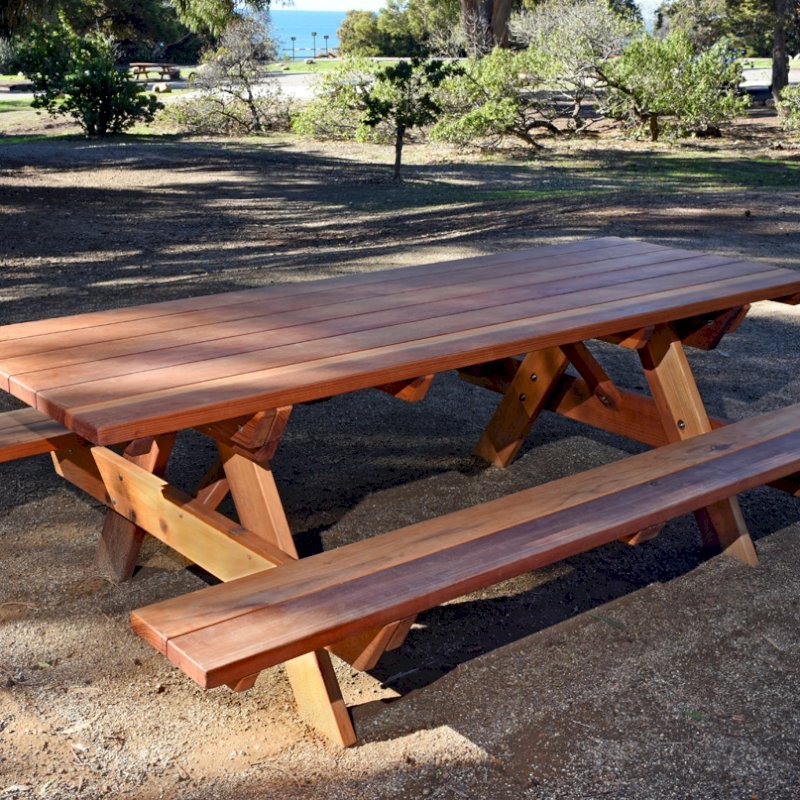 Forever Picnic Tables (Attached Benches) (Options: 8' L, 34 1/2" W, Side Benches, California Redwood, Standard Tabletop, Slightly Rounded Corners, No Umbrella Hole, Transparent Premium Sealant). Located at El Capitan State Beach near Santa Barbara, CA part of a 90 table installation completed in 2015. Forever Picnic Tables (Attached Benches) (Options: 8' L, 34 1/2" W, Side Benches, California Redwood, Standard Tabletop, Slightly Rounded Corners, No Umbrella Hole, Transparent Premium Sealant). Located at El Capitan State Beach near Santa Barbara, CA part of a 90 table installation completed in 2015.