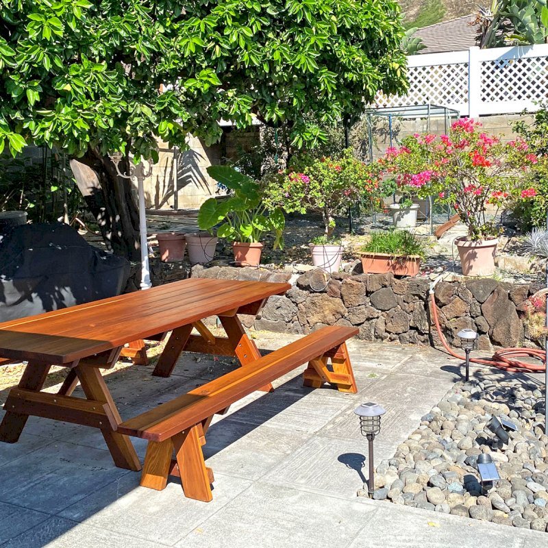 Forever Picnic Table (Unattached Benches) (Options: 8' L, 40 ¼" W, Side Benches, California Redwood, 1 Full Length Bench Per Side, Standard Tabletop, Slightly Rounded Corners, 2" Diameter Umbrella Hole, Transparent Premium Sealant). Photo Courtesy of L. Nakmura of Honolulu, Hawaii. Forever Picnic Table (Unattached Benches) (Options: 8' L, 40 ¼" W, Side Benches, California Redwood, 1 Full Length Bench Per Side, Standard Tabletop, Slightly Rounded Corners, 2" Diameter Umbrella Hole, Transparent Premium Sealant). Photo Courtesy of L. Nakmura of Honolulu, Hawaii.