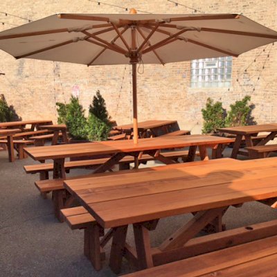 Custom Forever Picnic Tables (Unattached Benches) (Options: 10' L, 34 ½in W, Old-Growth, 2 Full Length Side Benches, Standard Tabletop, Squared Corners, 2 ½in Umbrella Hole, Standard Leg Flair, Transparent Premium). Using Two Tongue & Groove Matching 5 3/4" Boards to Create the Appearance of an 11 1/2" Wide Board Construction. Photo courtesy of Small Cheval Restaurant, 1732 N Milwaukee Ave, Chicago, IL 60647.