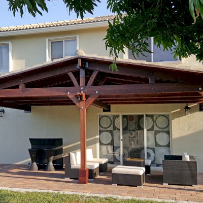 Forever Porch Pavilion (Options: 12' L x 25' W, California Redwood, 3-Post Anchor Kit for High-Wind, No Electrical Wiring Trim, 9ft Posts Height, No Ceiling Fan Base, No Curtain Rods, No Privacy Panels, Transparent Premium Sealant). Photo Courtesy of Carol Varela of Florida.