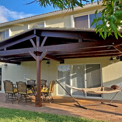 Forever Porch Pavilion (Options: 12' L x 25' W, California Redwood, 3-Post Anchor Kit for High-Wind, No Electrical Wiring Trim, 9ft Posts Height, No Ceiling Fan Base, No Curtain Rods, No Privacy Panels, Transparent Premium Sealant). Photo Courtesy of Carol Varela of Florida.