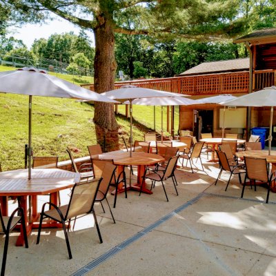 Helen's Octagonal Terrace Tables (Options: 5 ft, No Seating, California Redwood, Standard Tabletop, Rounded Corners, Umbrella Hole, Transparent Premium Sealant). Photo Courtesy of D. Flanigan of Silver Spring, Maryland.