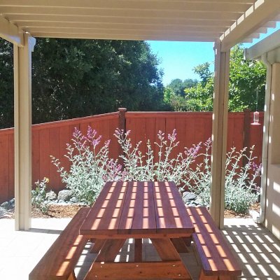 Heritage Large Wooden Picnic Table (Options: 8' L, 34 1/2" W, Side Benches, Unattached Benches, 1 Full Length Side Bench/Side, Forever Style Benches, Standard Tabletop, Slightly Rounded Corners, Standard Leg Flair, No Umbrella Hole, Transparent Premium Sealant). Photo Courtesy of T.Jacobi of San Luis Obispo, CA.