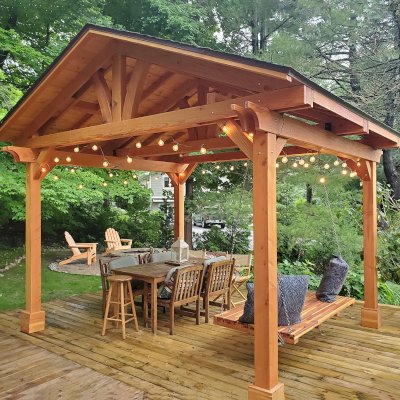 Jhoola Day Bed Swing Set (Options: 6' L, 36" W, Seat Only, Mosaic Redwood, All Beam Hanging Hardware, No Railings, Day Bed Style, No Cushion, Transparent Premium Sealant). Also Shows a Del Norte Pavilion and 2 Adirondack Chairs. Photo Courtesy of M. Jossens of Traverse City, MI.