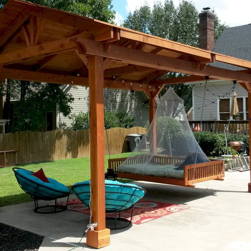 Jhoola Day Bed Swing Sets (Options: 7' L, 60" W, Seat Only, California Redwood, All Beam Hanging Hardware, Add 3 Railings (North, South and extra one, East or West), Day Bed Style, No Cushion, Transparent Premium Sealant). Also shows a Del Norte Pavilion. Jhoola Day Bed Swing Sets (Options: 7' L, 60" W, Seat Only, California Redwood, All Beam Hanging Hardware, Add 3 Railings (North, South and extra one, East or West), Day Bed Style, No Cushion, Transparent Premium Sealant). Also shows a Del Norte Pavilion.