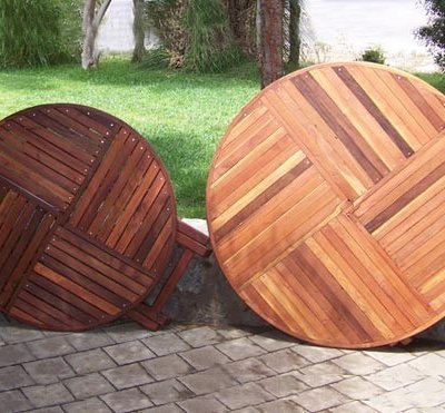 SIZE AND TABLETOP COMPARISON: Round Folding Table - Left: 42" in Old-Growth Redwood with Standard Tabletop Spacing, Karyn's Round Wooden Folding Table: Mature Redwood with the Seamless Tabletop Spacing.
