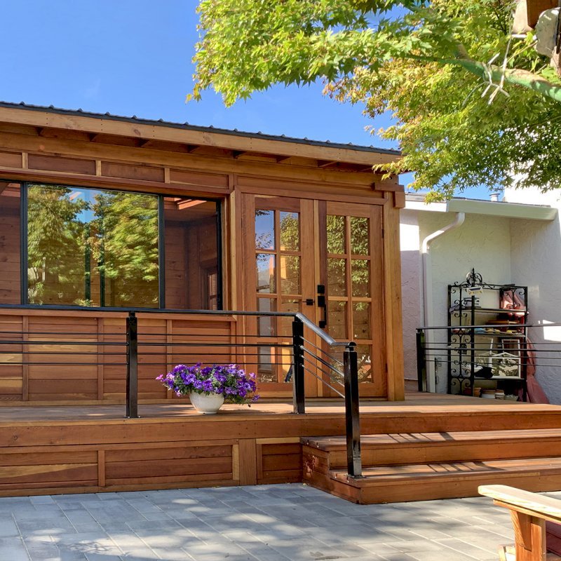Custom Backyard Cabin (Options: 18' L, 16' W, California Redwood, Sugar Pine Internal Walls and Ceiling, Windows Purchased Locally, With 2 3' x 5' Skylights, Custom Roof, Horizontal Siding, Custom French Door without Screens, Complete Floor & Deck, Custom Railings and Steps, Electrical Wire Trim on the Walls, Transparent Premium Sealant). Photo Courtesy of A. Ramon of South San Francisco, California. Custom Backyard Cabin (Options: 18' L, 16' W, California Redwood, Sugar Pine Internal Walls and Ceiling, Windows Purchased Locally, With 2 3' x 5' Skylights, Custom Roof, Horizontal Siding, Custom French Door without Screens, Complete Floor & Deck, Custom Railings and Steps, Electrical Wire Trim on the Walls, Transparent Premium Sealant). Photo Courtesy of A. Ramon of South San Francisco, California.