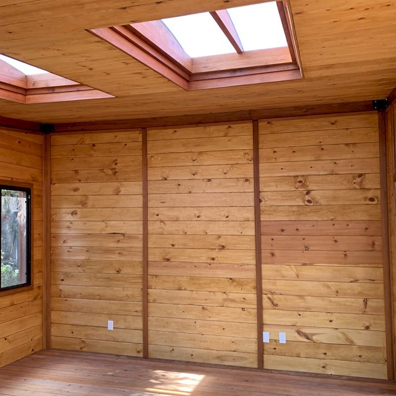 Custom Backyard Cabin (Options: 18' L, 16' W, California Redwood, Sugar Pine Internal Walls and Ceiling, Windows Purchased Locally, With 2 3' x 5' Skylights, Custom Roof, Horizontal Siding, Custom French Door without Screens, Complete Floor & Deck, Custom Railings and Steps, Electrical Wire Trim on the Walls, Transparent Premium Sealant). Photo Courtesy of A. Ramon of South San Francisco, California. Custom Backyard Cabin (Options: 18' L, 16' W, California Redwood, Sugar Pine Internal Walls and Ceiling, Windows Purchased Locally, With 2 3' x 5' Skylights, Custom Roof, Horizontal Siding, Custom French Door without Screens, Complete Floor & Deck, Custom Railings and Steps, Electrical Wire Trim on the Walls, Transparent Premium Sealant). Photo Courtesy of A. Ramon of South San Francisco, California.