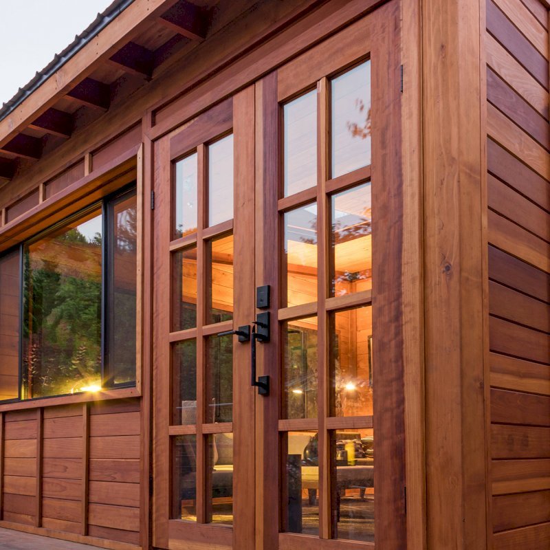 Custom Backyard Cabin (Options: 18' L, 16' W, California Redwood, Sugar Pine Internal Walls and Ceiling, Windows Purchased Locally, With 2 3' x 5' Skylights, Custom Roof, Horizontal Siding, Custom French Door without Screens, Complete Floor & Deck, Custom Railings and Steps, Electrical Wire Trim on the Walls, Transparent Premium Sealant). Photo Courtesy of A. Ramon of South San Francisco, California. Custom Backyard Cabin (Options: 18' L, 16' W, California Redwood, Sugar Pine Internal Walls and Ceiling, Windows Purchased Locally, With 2 3' x 5' Skylights, Custom Roof, Horizontal Siding, Custom French Door without Screens, Complete Floor & Deck, Custom Railings and Steps, Electrical Wire Trim on the Walls, Transparent Premium Sealant). Photo Courtesy of A. Ramon of South San Francisco, California.