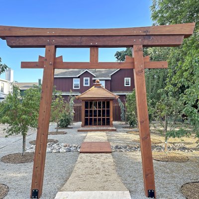 Kikue's Tea House (Options: 8 ft L x 8 ft W, 7' Wall Height, Shiplap Roof, Mature Redwood, No Electrical Wiring Trim, No Deck [Installed on Existing Deck], Transparent Premium Sealant). Photo Also Shows a 6' Forever Foot Bridge and a Custom Torii Gate. Photo Courtesy of C. Szumski of Sonoma, CA.