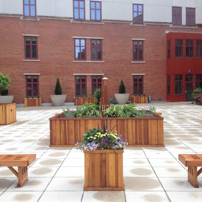 Lighthouse Garden Bench (Options: 4 ft L x 16 inches W x 17 inches H, Douglas-fir, Transparent Premium Sealant) and Napa Planters (Options: Different Sizes, Redwood, No Base or Casters, Transparent Premium Sealant). Photo Courtesy of Michael Del Pizzo of Bloomfield, New Jersey.