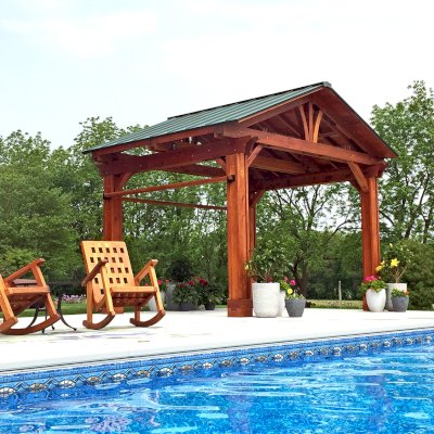 The Lighthouse Rocking Chair (Options: California Redwood, No Cushion, Transparent Premium Sealant). Photo Also Shows a Del Norte Pavilion. Photo Courtesy of Sandra Briner of Westville, Indiana.