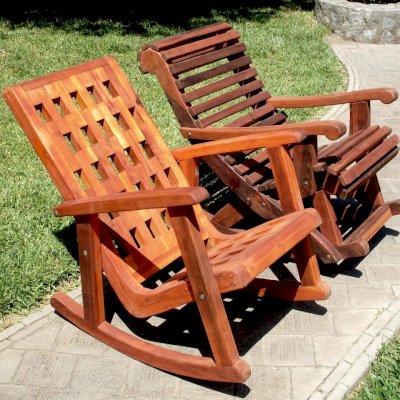 Comparison of Lighthouse (front) and Ensenada Highback Rocking Chairs (rear). Lighthouse in California Redwood with Transparent Premium Sealant, Ensenada in Old-Growth Redwood with Coffee Stain.