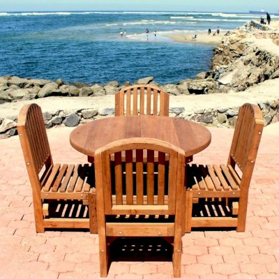 Luna Arch Back Wooden Chair with 4 ft Round Patio Table, Seamless Tabletop Design - Mature Redwood. Photo Courtesy of the Estero Beach Resort in Ensenada, Baja California, Mexico.
