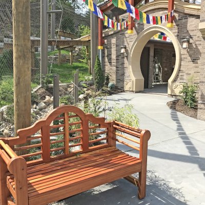 Lutyens Wooden Bench (Options: 4 ft, California Redwood, No Cushion, No Engraving, Transparent Premium Sealant). Bench seat was made deeper for ADA accessibility as a custom detail. Photo Courtesy of Cleveland Metroparks Zoo. Bench installed at their new Asian Highlands exhibit. Take a closer look and you’ll see one of their snow leopards in the enclosed walkway of the building. 