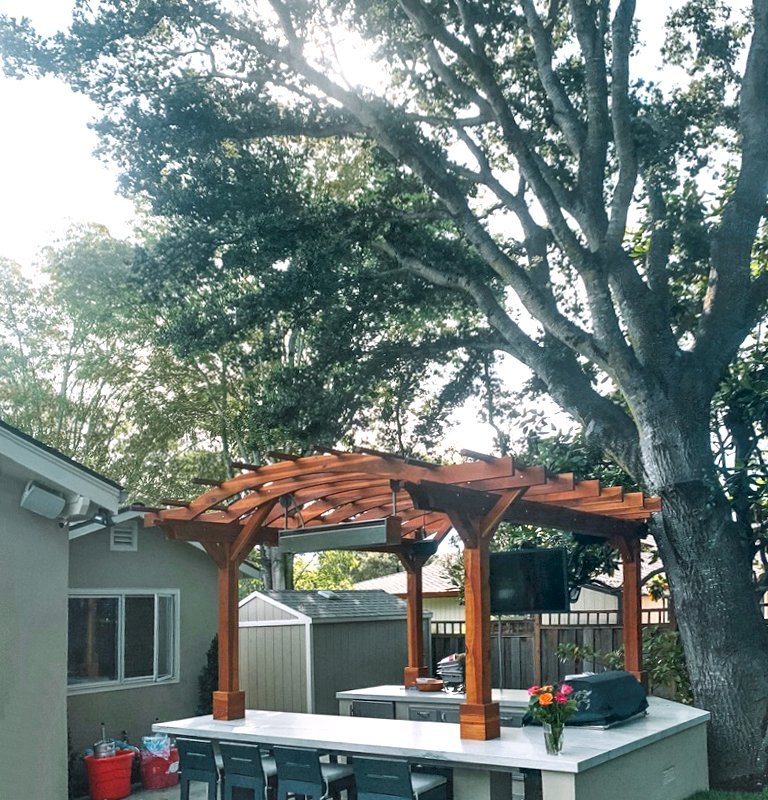 Marin Outdoor Kitchen Pergola (Options: 14' L x 14' Arc W, California Redwood, Unattached, 2 Post Electrical Wiring Trim, 4 Post Anchor Kit for Stone, No Ceiling Fan Base, No Privacy, No Curtain Rods, 9 ft Post Height (front posts wrapped with masonry), Transparent Premium Sealant). Photo Courtesy of C. Funkhouser of Hillsborough, California. Marin Outdoor Kitchen Pergola (Options: 14' L x 14' Arc W, California Redwood, Unattached, 2 Post Electrical Wiring Trim, 4 Post Anchor Kit for Stone, No Ceiling Fan Base, No Privacy, No Curtain Rods, 9 ft Post Height (front posts wrapped with masonry), Transparent Premium Sealant). Photo Courtesy of C. Funkhouser of Hillsborough, California.