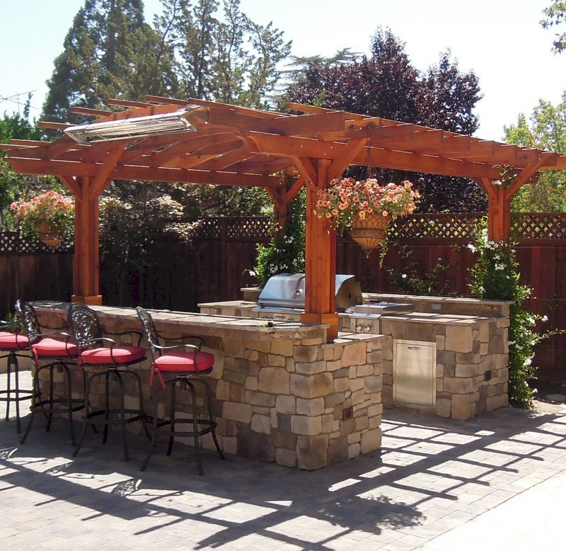 Marin Outdoor Kitchen Pergola (Options: 14' L x 16' Arc W, California Redwood, Unattached, 2 Post Electrical Wiring Trim, Arched Roof without Lattice Panels, 4 Post Anchor Kit for Stone, No Ceiling Fan Base, No Privacy, No Curtain Rods, 9 ft Post Height (front posts wrapped with masonry), Transparent Premium Sealant). Marin Outdoor Kitchen Pergola (Options: 14' L x 16' Arc W, California Redwood, Unattached, 2 Post Electrical Wiring Trim, Arched Roof without Lattice Panels, 4 Post Anchor Kit for Stone, No Ceiling Fan Base, No Privacy, No Curtain Rods, 9 ft Post Height (front posts wrapped with masonry), Transparent Premium Sealant).
