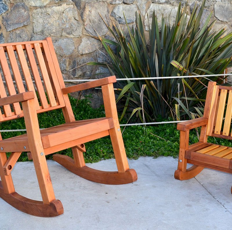 Massive Rocking Chair (Options: Standard Width, Tall, Mature Redwood, No Cushion, Transparent Premium Sealant). Photo Also Shows a Kid's Rocking Chair in California Redwood. Massive Rocking Chair (Options: Standard Width, Tall, Mature Redwood, No Cushion, Transparent Premium Sealant). Photo Also Shows a Kid's Rocking Chair in California Redwood.