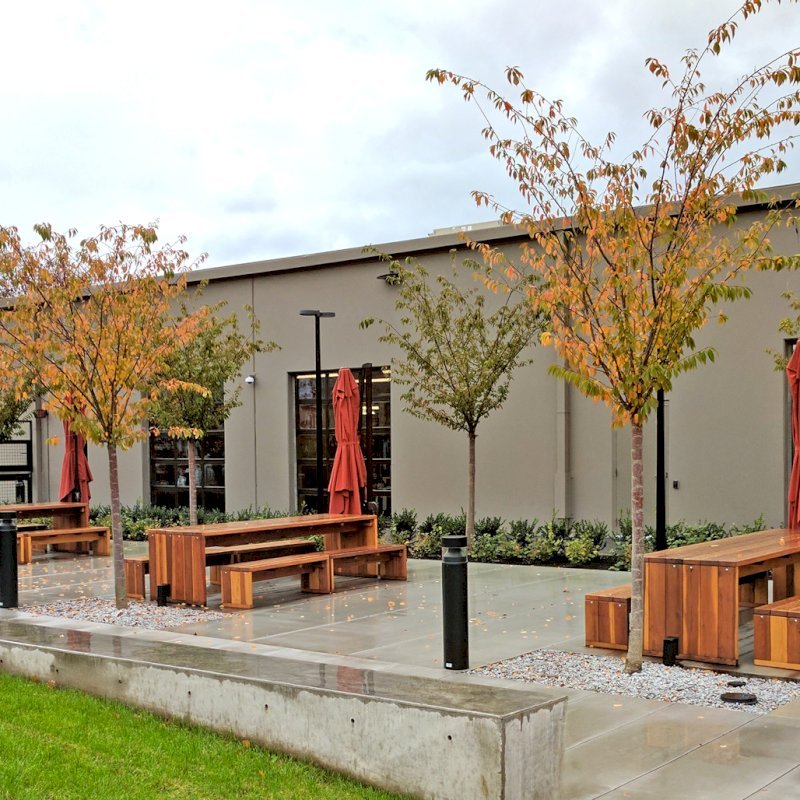 Maynard Modern Redwood Patio Tables (Options: 10' L, 34 1/2" W Tabletop, Side Benches, California Redwood, 2 Half Length Benches Per Side, Standard Tabletop, No Umbrella Hole, Transparent Premium Sealant). Photo Courtesy of Bill Judge of The Hewlett Packard Plant in Vancouver, WA. Maynard Modern Redwood Patio Tables (Options: 10' L, 34 1/2" W Tabletop, Side Benches, California Redwood, 2 Half Length Benches Per Side, Standard Tabletop, No Umbrella Hole, Transparent Premium Sealant). Photo Courtesy of Bill Judge of The Hewlett Packard Plant in Vancouver, WA.