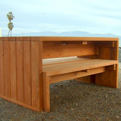 SIDE VIEW OF TABLE WITH BENCHES UNDERNEATH: Maynard Modern Redwood Patio Table (Options: 6' L, 34 1/2" W Tabletop, Side Benches, Douglas-fir, 1 Full Length Side Bench/Side, Standard Tabletop, No Umbrella Hole, Transparent Premium Sealant). 