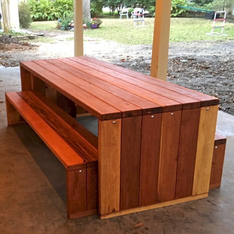 Maynard Modern Redwood Patio Table (Options: 7' L, 34 1/2" W Tabletop, Side Benches, California Redwood, One Full Length Bench on One Side and Two Half Length Benches on the Other by Custom Request), Standard Tabletop, No Umbrella Hole, Transparent Premium Sealant). Photo Courtesy of P. Ankney of Bellaire, TX. Maynard Modern Redwood Patio Table (Options: 7' L, 34 1/2" W Tabletop, Side Benches, California Redwood, One Full Length Bench on One Side and Two Half Length Benches on the Other by Custom Request), Standard Tabletop, No Umbrella Hole, Transparent Premium Sealant). Photo Courtesy of P. Ankney of Bellaire, TX.