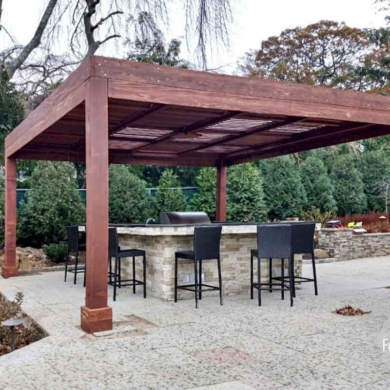 Modern Louvered Garden Pergola (Options: 18' L x 18' W, 8" x 8" Posts, Mobile Louvers, California Redwood, 10 ft H, 1 Electrical Wiring Trim, No Curtain Rods, 4 Post Anchor Kit for Concrete, No Post Decorative Trims, 1 Ceiling Fan Base, Coffee-Stain Premium Sealant). Photo Courtesy of C. Passmore of Lawrence, New York. Modern Louvered Garden Pergola (Options: 18' L x 18' W, 8" x 8" Posts, Mobile Louvers, California Redwood, 10 ft H, 1 Electrical Wiring Trim, No Curtain Rods, 4 Post Anchor Kit for Concrete, No Post Decorative Trims, 1 Ceiling Fan Base, Coffee-Stain Premium Sealant). Photo Courtesy of C. Passmore of Lawrence, New York.