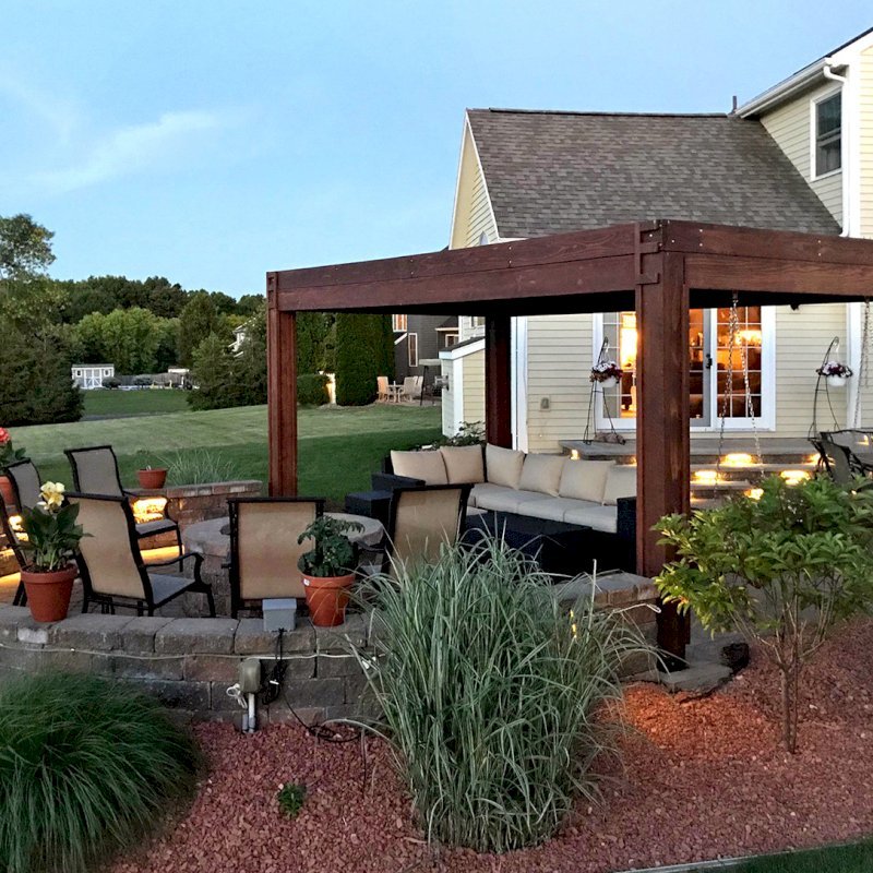 Modern Louvered Garden Pergola (Options: 10' L x 18' W, 8" x 8" Posts, Mobile Louvers, Mature Redwood, 9 ft H, 2 Electrical Wiring Trims, 4 Post Anchor Kit for Concrete, Custom Vertical Post Decorative Trims, No Ceiling Fan Base, Coffee-Stain Premium Sealant). Photo Courtesy of D. Gauthier of Liverpool, NY. Modern Louvered Garden Pergola (Options: 10' L x 18' W, 8" x 8" Posts, Mobile Louvers, Mature Redwood, 9 ft H, 2 Electrical Wiring Trims, 4 Post Anchor Kit for Concrete, Custom Vertical Post Decorative Trims, No Ceiling Fan Base, Coffee-Stain Premium Sealant). Photo Courtesy of D. Gauthier of Liverpool, NY.