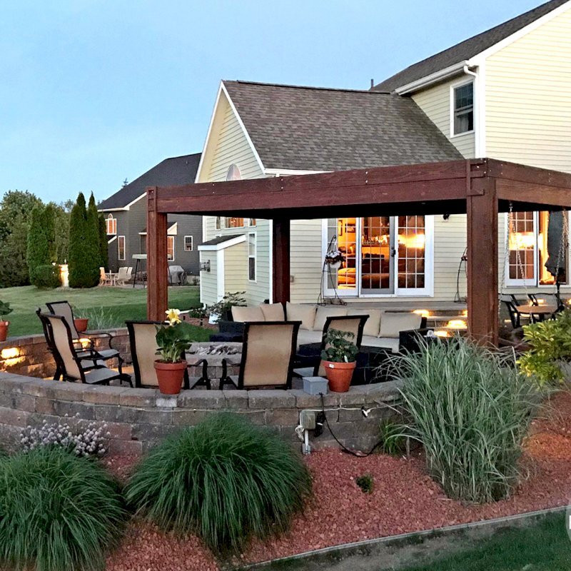 Modern Louvered Garden Pergola (Options: 10' L x 18' W, 8" x 8" Posts, Mobile Louvers, Mature Redwood, 9 ft H, 2 Electrical Wiring Trims, 4 Post Anchor Kit for Concrete, Custom Vertical Post Decorative Trims, No Ceiling Fan Base, Coffee-Stain Premium Sealant). Photo Courtesy of D. Gauthier of Liverpool, NY. Modern Louvered Garden Pergola (Options: 10' L x 18' W, 8" x 8" Posts, Mobile Louvers, Mature Redwood, 9 ft H, 2 Electrical Wiring Trims, 4 Post Anchor Kit for Concrete, Custom Vertical Post Decorative Trims, No Ceiling Fan Base, Coffee-Stain Premium Sealant). Photo Courtesy of D. Gauthier of Liverpool, NY.