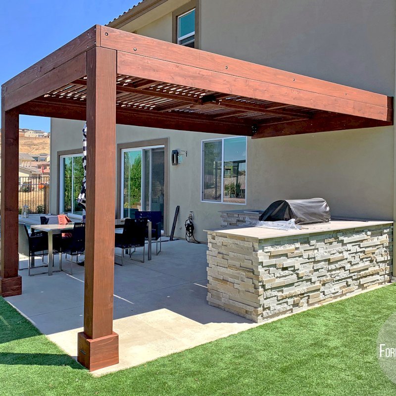 Modern Louvered Garden Pergola (Options: 16' L x 10' W, 8" x 8" Posts, Mobile Louvers, California Redwood, 9.5 ft H, 1 Electrical Wiring Trim, No Curtain Rods, 2 Post Anchor Kit for Concrete, Attached to Wall by Custom Request, No Post Decorative Trims, 1 Ceiling Fan Base, Coffee Stain Premium Sealant). Photo Courtesy of J. Murphy of Eldorado Hills, California. Modern Louvered Garden Pergola (Options: 16' L x 10' W, 8" x 8" Posts, Mobile Louvers, California Redwood, 9.5 ft H, 1 Electrical Wiring Trim, No Curtain Rods, 2 Post Anchor Kit for Concrete, Attached to Wall by Custom Request, No Post Decorative Trims, 1 Ceiling Fan Base, Coffee Stain Premium Sealant). Photo Courtesy of J. Murphy of Eldorado Hills, California.