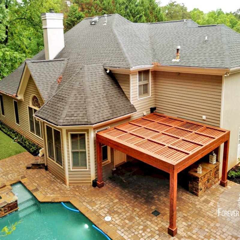 Modern Louvered Garden Pergola (Options: 15' L x 15' W, 8" x 8" Posts, Mobile Louvers, Douglas-fir, 9 ft H, 1 Electrical Wiring Trim, 2 Curtain Rods, 4 Post Anchor Kit for Concrete, No Post Decorative Trims, 1 Ceiling Fan Base, Coffee-Stain Premium Sealant). Photo Courtesy of J. Mcknight of Smyrna, Georgia. Modern Louvered Garden Pergola (Options: 15' L x 15' W, 8" x 8" Posts, Mobile Louvers, Douglas-fir, 9 ft H, 1 Electrical Wiring Trim, 2 Curtain Rods, 4 Post Anchor Kit for Concrete, No Post Decorative Trims, 1 Ceiling Fan Base, Coffee-Stain Premium Sealant). Photo Courtesy of J. Mcknight of Smyrna, Georgia.