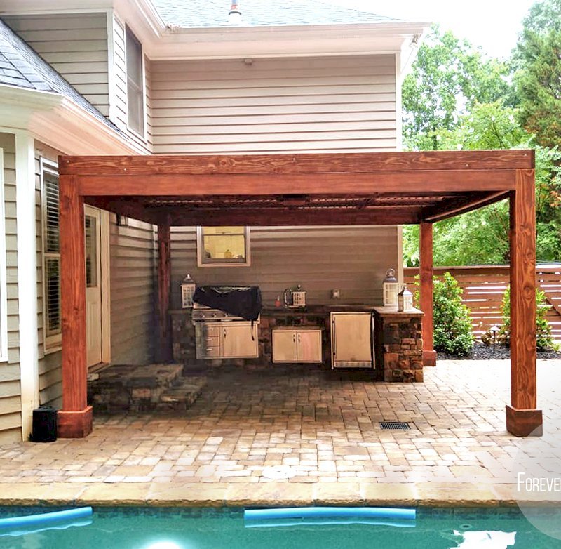 Modern Louvered Garden Pergola (Options: 15' L x 15' W, 8" x 8" Posts, Mobile Louvers, Douglas-fir, 9 ft H, 1 Electrical Wiring Trim, 2 Curtain Rods, 4 Post Anchor Kit for Concrete, No Post Decorative Trims, 1 Ceiling Fan Base, Coffee-Stain Premium Sealant). Photo Courtesy of J. Mcknight of Smyrna, Georgia. Modern Louvered Garden Pergola (Options: 15' L x 15' W, 8" x 8" Posts, Mobile Louvers, Douglas-fir, 9 ft H, 1 Electrical Wiring Trim, 2 Curtain Rods, 4 Post Anchor Kit for Concrete, No Post Decorative Trims, 1 Ceiling Fan Base, Coffee-Stain Premium Sealant). Photo Courtesy of J. Mcknight of Smyrna, Georgia.