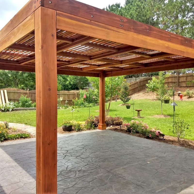 Modern Louvered Garden Pergola (Options: 16' L x 16' W, 8" x 8" Posts, Mobile Louvers, California Redwood, 9 ft H, No Electrical Wiring Trim, No Curtain Rods, 4 Post Anchor Kit for Concrete, No Post Decorative Trims, No Ceiling Fan Base, Transparent Premium Sealant). Photo Courtesy of J. McLaughlin of Cary, North Carolina. Modern Louvered Garden Pergola (Options: 16' L x 16' W, 8" x 8" Posts, Mobile Louvers, California Redwood, 9 ft H, No Electrical Wiring Trim, No Curtain Rods, 4 Post Anchor Kit for Concrete, No Post Decorative Trims, No Ceiling Fan Base, Transparent Premium Sealant). Photo Courtesy of J. McLaughlin of Cary, North Carolina.