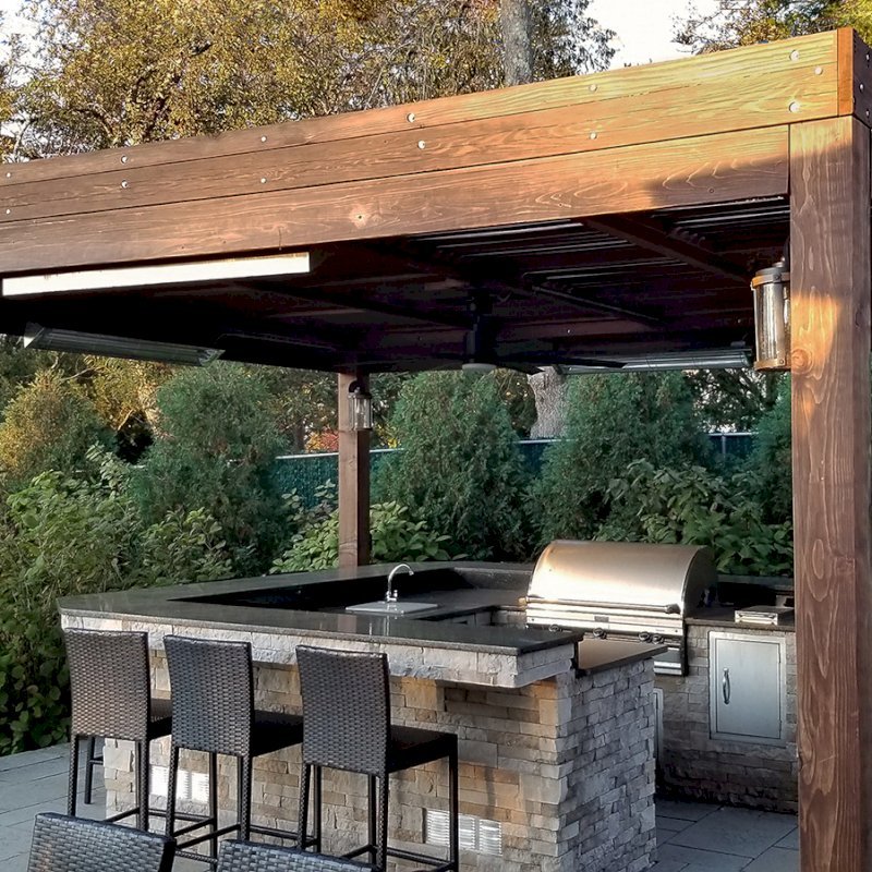 Modern Louvered Garden Pergola (Options: 18' L x 18' W, 8" x 8" Posts, Mobile Louvers, California Redwood, 10 ft H, 1 Electrical Wiring Trim, No Curtain Rods, 4 Post Anchor Kit for Concrete, No Post Decorative Trims, 1 Ceiling Fan Base, Coffee-Stain Premium Sealant). Photo shows faded finish - installation was completed 2 years prior. Photo Courtesy of C. Passmore of Lawrence, New York. Modern Louvered Garden Pergola (Options: 18' L x 18' W, 8" x 8" Posts, Mobile Louvers, California Redwood, 10 ft H, 1 Electrical Wiring Trim, No Curtain Rods, 4 Post Anchor Kit for Concrete, No Post Decorative Trims, 1 Ceiling Fan Base, Coffee-Stain Premium Sealant). Photo shows faded finish - installation was completed 2 years prior. Photo Courtesy of C. Passmore of Lawrence, New York.